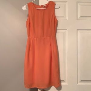 Coral hour glass dress.